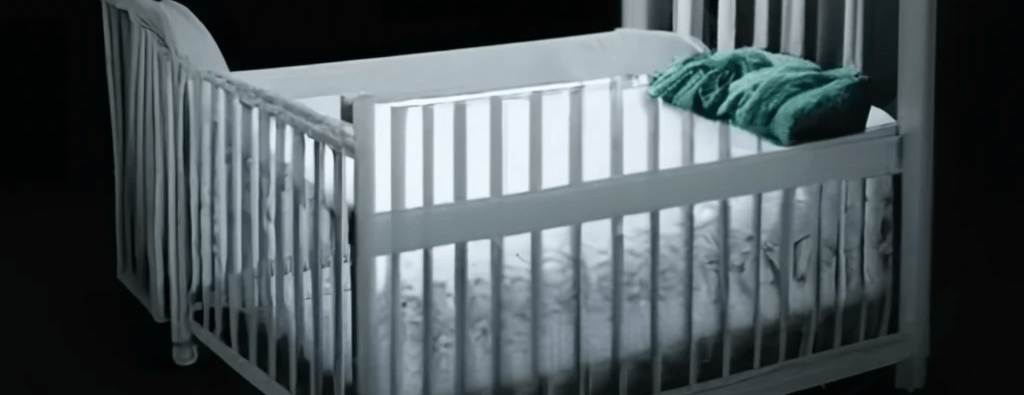 A picture of a cropped baby crib