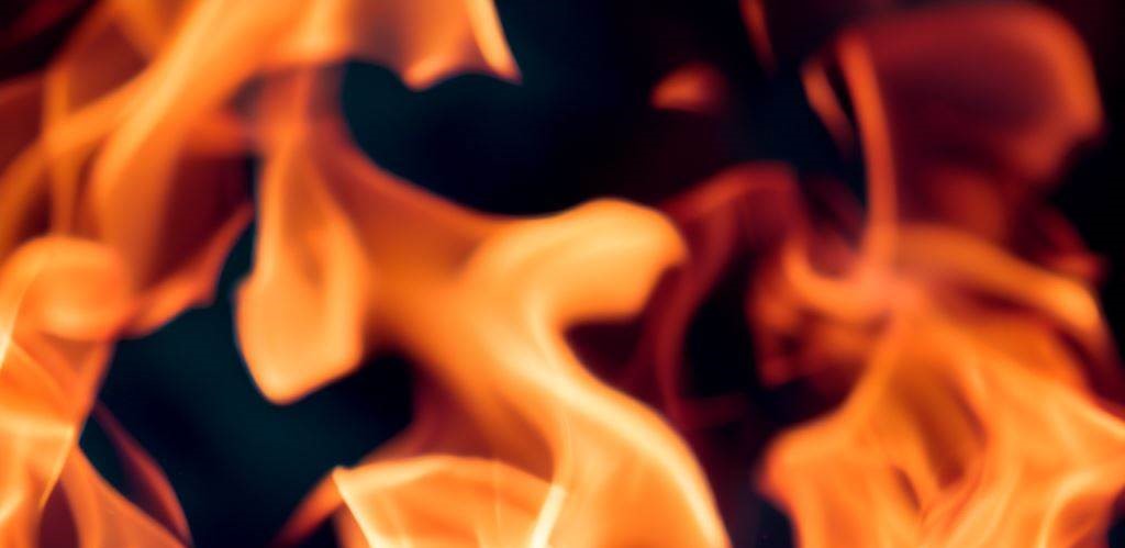 close up picture of flames from a fire with a black background