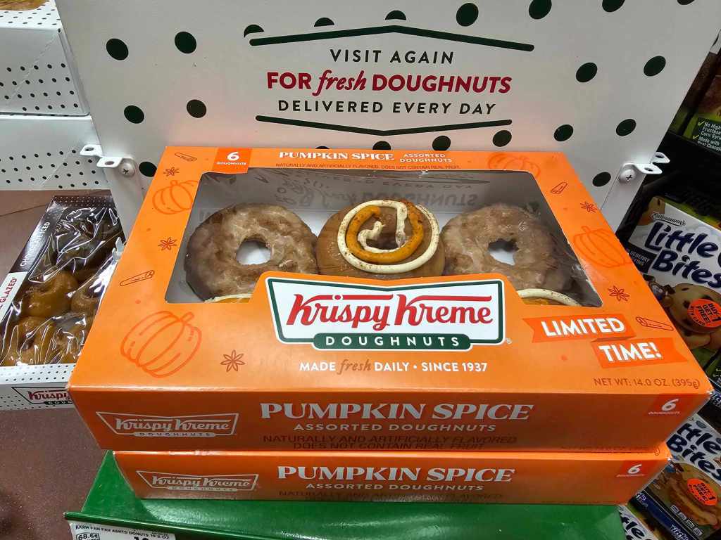 A picture of a six pack of Krispy Kreme assorted pumpkin spice donuts