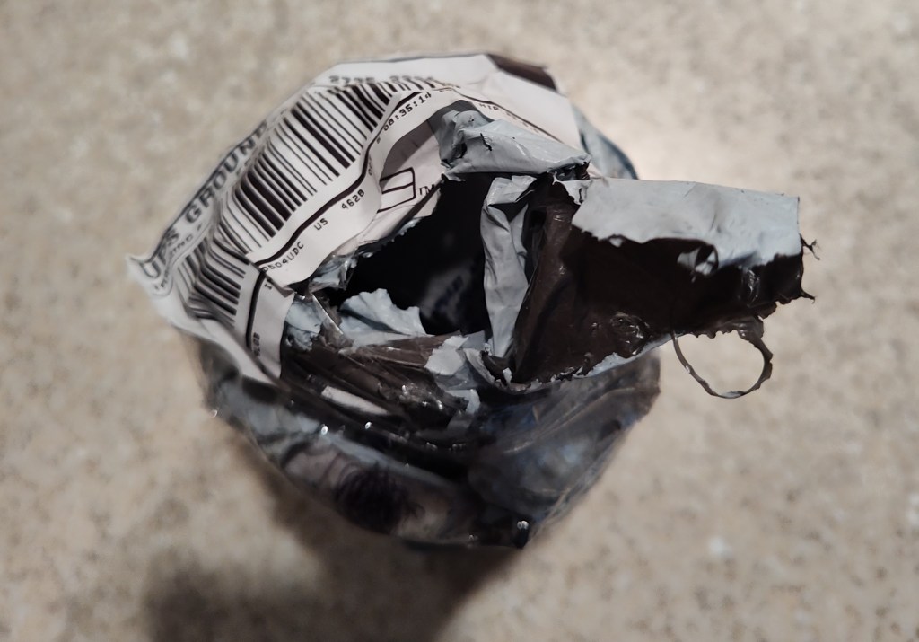 A picture of a damaged package from the top view.